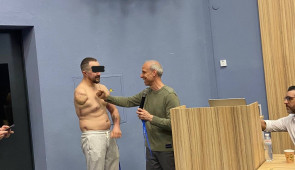 Dr. Cohen evaluating a Ukrainian Special Forces soldier with a right upper extremity amputation and suspected pain from a neuroma
