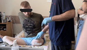 Dr. Cohen evaluating a Ukrainian Service Member with a left lower extremity amputation for consideration of medications and possible nerve blocks