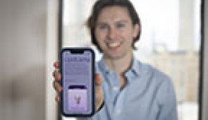 Medical student Tyler Smith showing the app he developed 