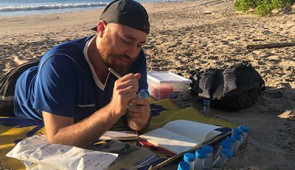 Northwestern University Ph.D. candidate Matthew Verosloff samples water in Costa Rica to test the new system in the field.