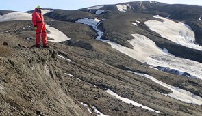 A Northwestern University researcher stands on the Lopez de Bertodano Formation, a well-preserved, fossil-rich area on the west side of Seymour Island in Antarctica.