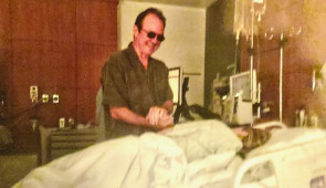 After her melanoma surgery, Heidi Tarr holds her late father’s hands. Tarr, who tanned indoors frequently as a teenager, later donated a skin biopsy for the study (credit: Heidi Tarr)