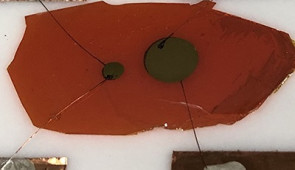 Neutron detectors (circles with diameters of 2 mm and 5 mm) on the same single crystal (orange)