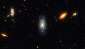 This Gemini North image, superimposed on an image taken with the Hubble Space Telescope, shows the telltale near-infrared afterglow of a kilonova produced by a long GRB (GRB 211211A). This discovery challenges the prevailing theory that long GRBs exclusively come from supernovae, the end-of-life explosions of massive stars. Credit: International Gemini Observatory/NOIRLab/NSF/AURA/M. Zamani; NASA/ESA