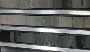 Sediment core from the eastern Indian Ocean, offshore of southwest Australia. Lighter colored sedimentary rocks (below right) are rich in carbonate microfossils deposited before the ocean acidification event, and darker mudstones (left) represent the time interval when ocean acidification occurred. These stones are darker due to the absence of carbonate microfossils caused by more corrosive seawater during the acidification event. Credit: Matt Jones