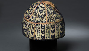 Cap with striped inscribed silk, Egypt or Syria, Mamluk period, probably sultanate of al-Nasir al-Din Muhammad (reigned 1293–1341, with two interruptions), 14th century, Lampas fabric, silk and gold, Cleveland Museum of Art, purchase from the J.H. Wade Fund, 1985.5