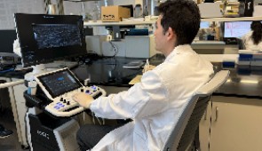 The study's co-first author Mingzheng Wu tests the system in the lab