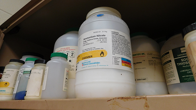 A bottle of ammonium nitrate sits among a number of other excess chemical products left over from science experiments conducted at Chute Middle School in Evanston