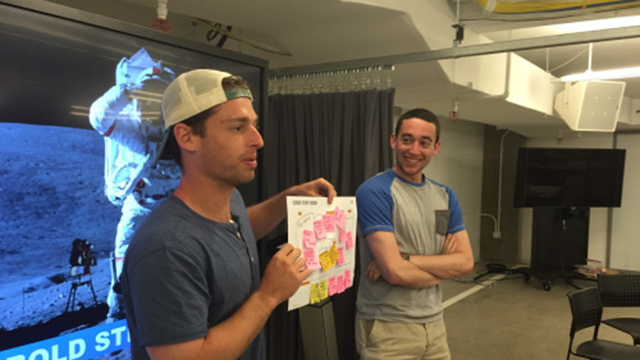 Northwestern seniors Andrew Zessar and Nick Scoliard present "5 Bold Steps" for their business during summer Wildfire 2016 at The Garage