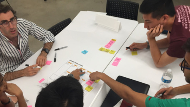 The team behind the student startup Kairos collaborates over its value proposition during summer Wildfire 2016 at The Garage