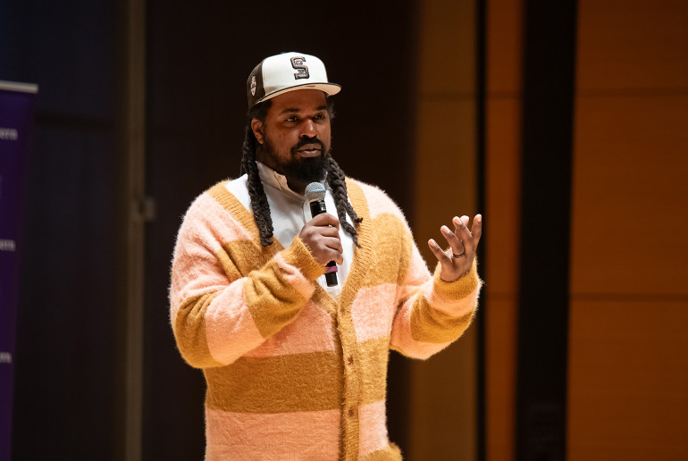 Shermann “Dilla” Thomas holds a microphone during the event