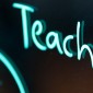 TEACHx logo in neon blue