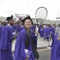 Graduate with tennis racket