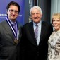 Michael Terry, who holds the inaugural Dr. Charles and Leslie Snorf Professorship in Orthopaedic Surgery, stands with benefactors Charles R. Snorf ’58 MD, ’63 GME and Leslie Snorf at a May 24, 2016, investiture ceremony 