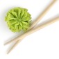 Green wasabi and a pair of chopsticks