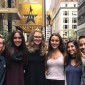 Students pose for a photo outside the theater where "Hamilton" is performed.