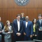 From left: Lane Lansdown, JD ’18, Hannah Freiman JD ’18, Coach Mark Duric, Coach Kendrick Washington, Amanda Tzivas JD ’19 and Joey Becker JD ’18. Judge Rebecca Pallmeyer, who presided over the final round, is in the background. The team will compete in January at the national labor law championship.