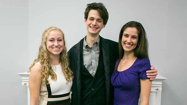 (From left to right) 2018 Mitchell Scholar Hadley Pfalzgraf and 2018 Marshall Scholars Lars Benson and Lucia Brunel. All three will graduate in June. (Photo by Morgan Searles)