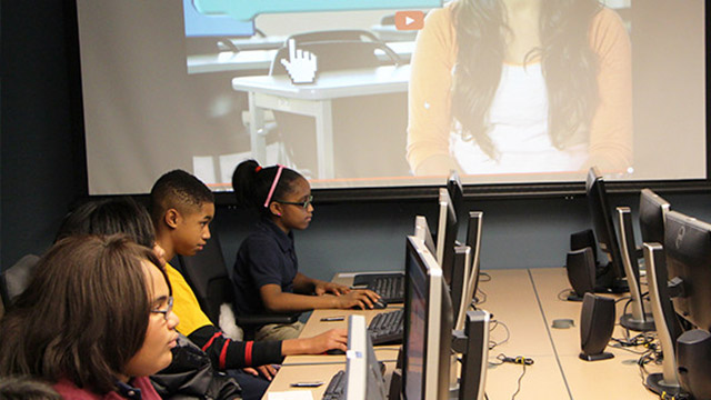 Young people work on computers