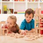 Two children play with wooden blocks