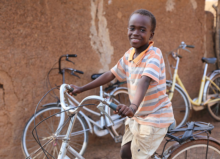 Child on a bike in Ghana