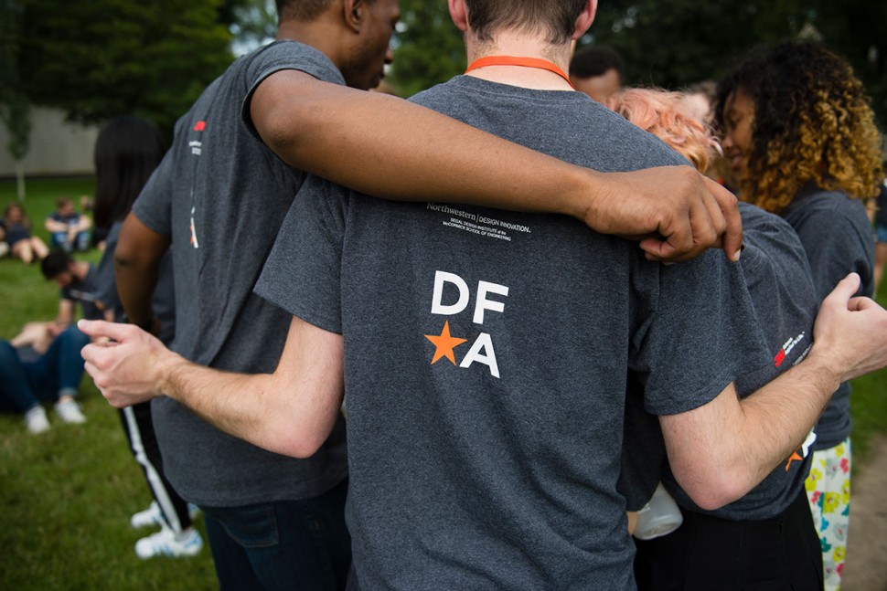 Students in DFA tshirts hugging