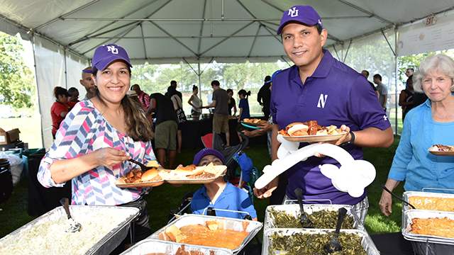 Northwestern volunteers serving food at the picnic