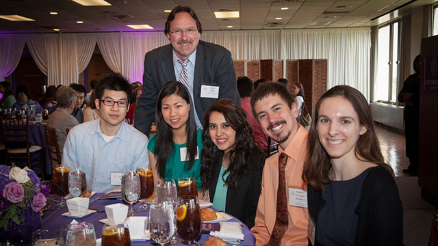 Mike Mills with scholarship recipients at a 2013 Scholarship Luncheon.
