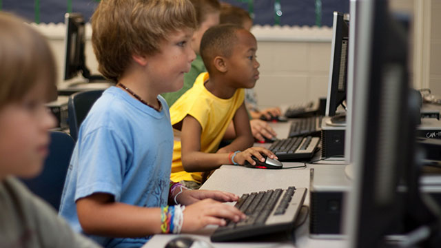 Kids working on computer
