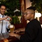 Photo of someone pouring someone else a beer at a bar