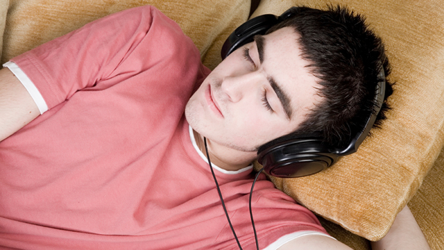 Image of a person sleeping with headphones on