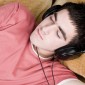 Image of a person sleeping with headphones on