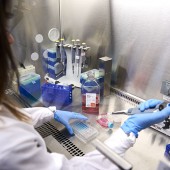 Woman using a micropipette