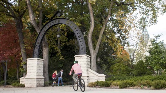 cyclist passing under Weber arch