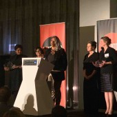 Image of Women's Center Director Sekile M. Nzinga accepting the YWCA award