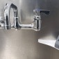 Image of the opal handwashing device next to a sink