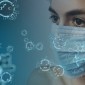 Woman wearing mask with COVID-19 coronavirus