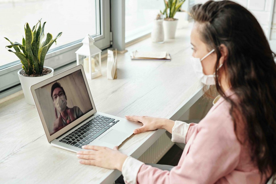 A doctor and COVID patient on a video call