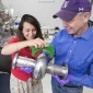 SQMS Director Anna Grassellino and Deputy Director James Sauls hold a superconducting radio-frequency cavity inside the Material Science Lab at the Department of Energy’s Fermi National Accelerator Laboratory. Credit: Reidar Hahn, Fermilab