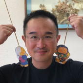 Alvin Chan presents the kamishibai 'Straw Hat Statues' for Imagine U Storytime