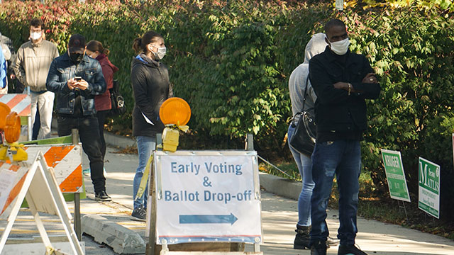 masked voters at poll