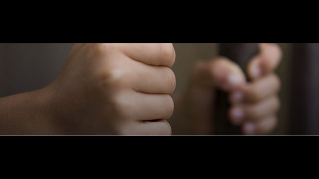 The Northwestern Juvenile Project 15 year study published April 5 in JAMA Pediatrics youth in detention with hands on bars