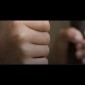 youth in detention with hands on bars