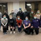 Group poses in vaccine clinic