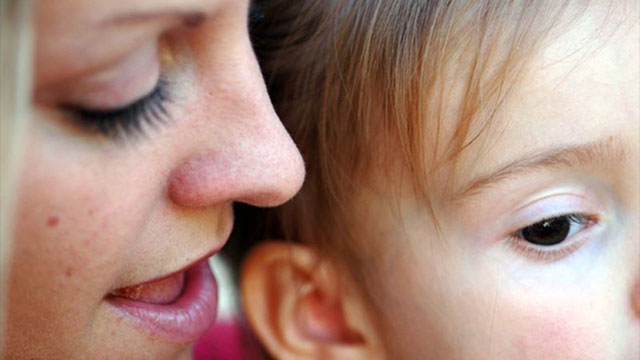 mother talking to baby