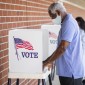 man votes in 2020 presidential election with a mask on