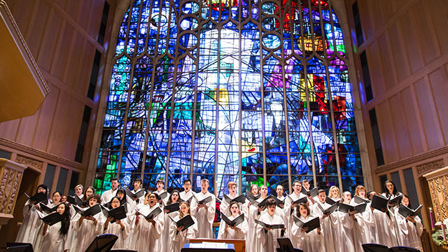 "A Festival of Lessons and Carols" in Alice Millar Chapel. Photo by Elliot Mandel. a choir sings in Alice Millar Chapel