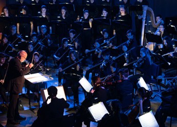 Donald Nally conducting orchestra and choirs