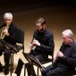 French horn player and two clarinetists