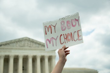 Protest sign in front of Supreme Court